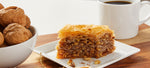 pureBaklava - photo of best baklava on dish next to coffee and walnuts