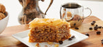 Slice of Baklava on plate with cup of coffee
